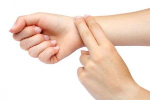 Place your index and middle fingers on your wrist to find your pulse.